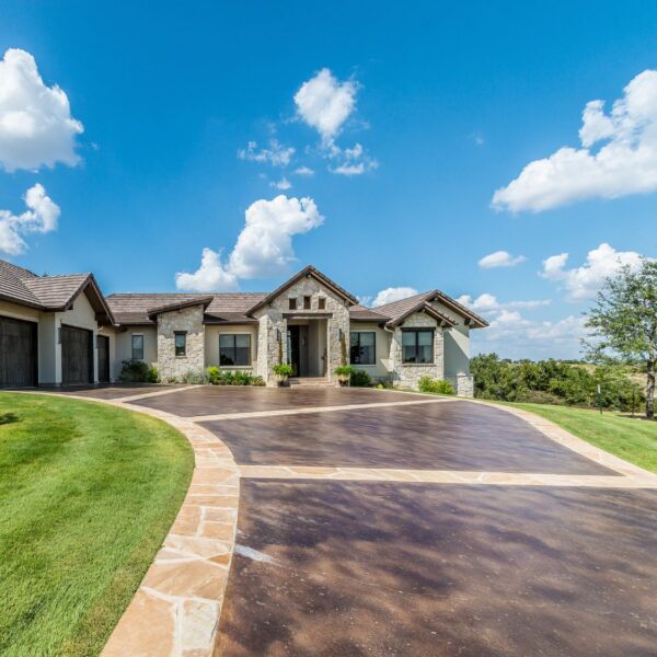 Exotic coloured driveway in front of rural mansion